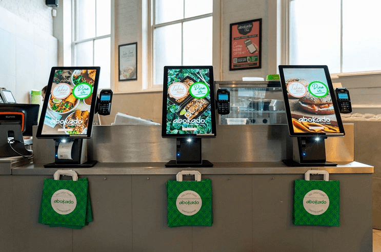 Kurve POS Kiosk Stands In a Casual Fast Food Restaurant